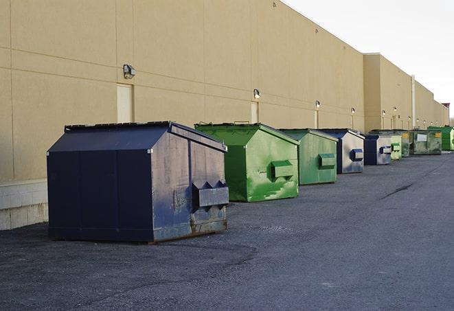 a pack of different construction bins lined up for service in Bedford, TX